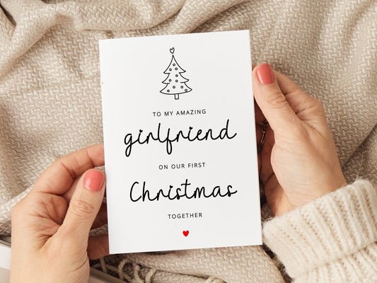 Girlfriend Christmas card which reads 'to my amazing girlfriend on our first Christmas together' with an illustration of a Christmas tree.