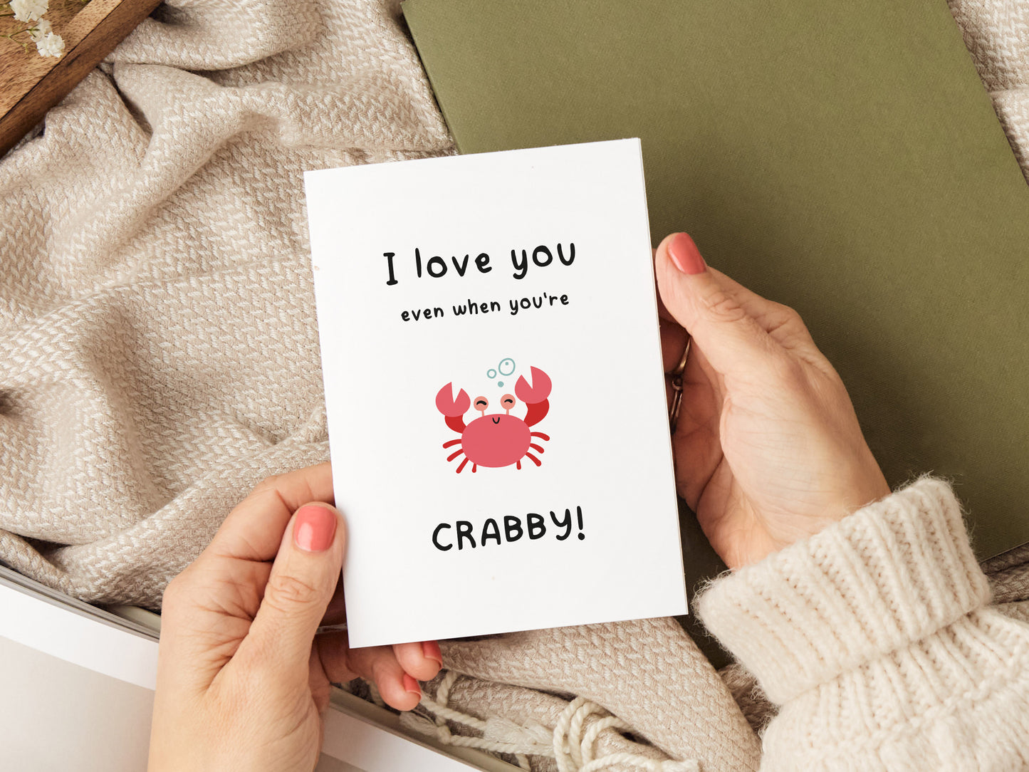 Greeting card which reads 'I love you even when you're crabby' with an illustration of a crab.