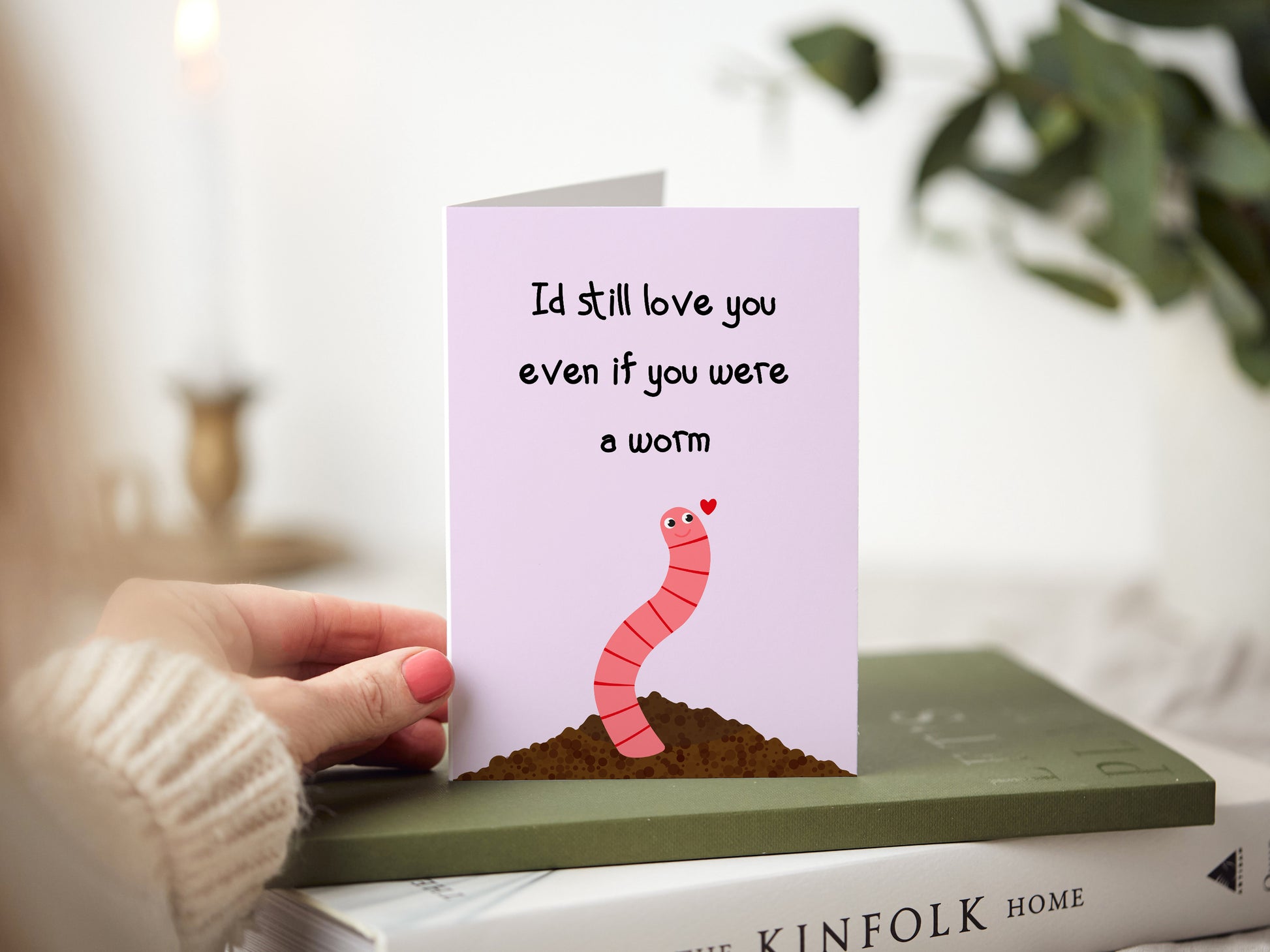 Anniversary card which reads 'I'd still love you even if you were a worm' with a cartoon illustration of a worm coming out of the soil.