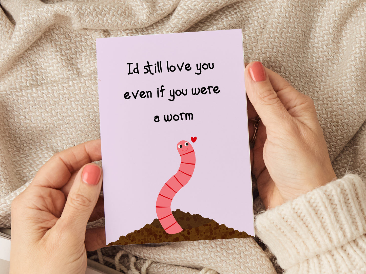 Anniversary card which reads 'I'd still love you even if you were a worm' with a cartoon illustration of a worm coming out of the soil.