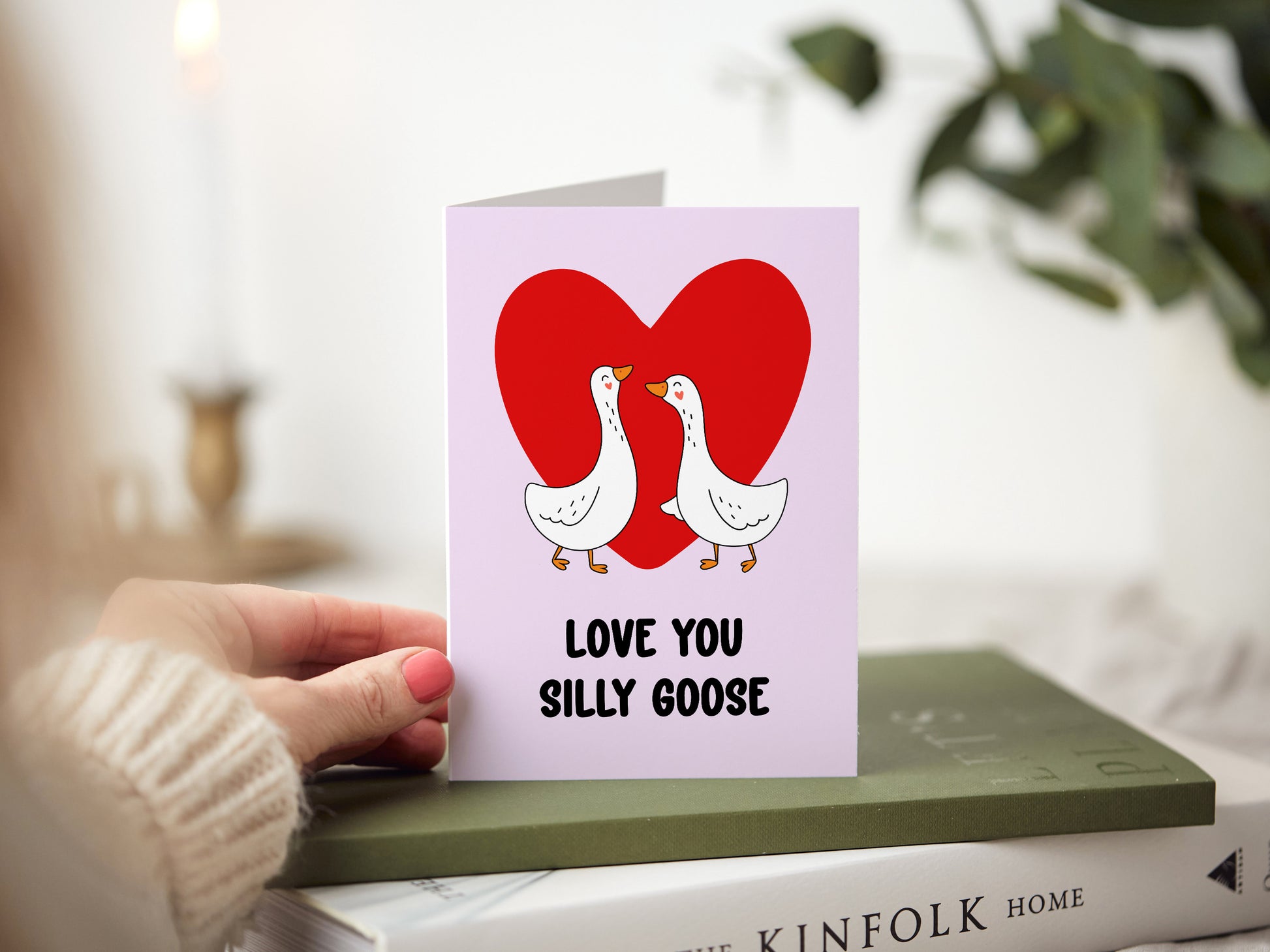 Anniversary card which reads 'love you silly goose' with an illustration of two geese and a heart.