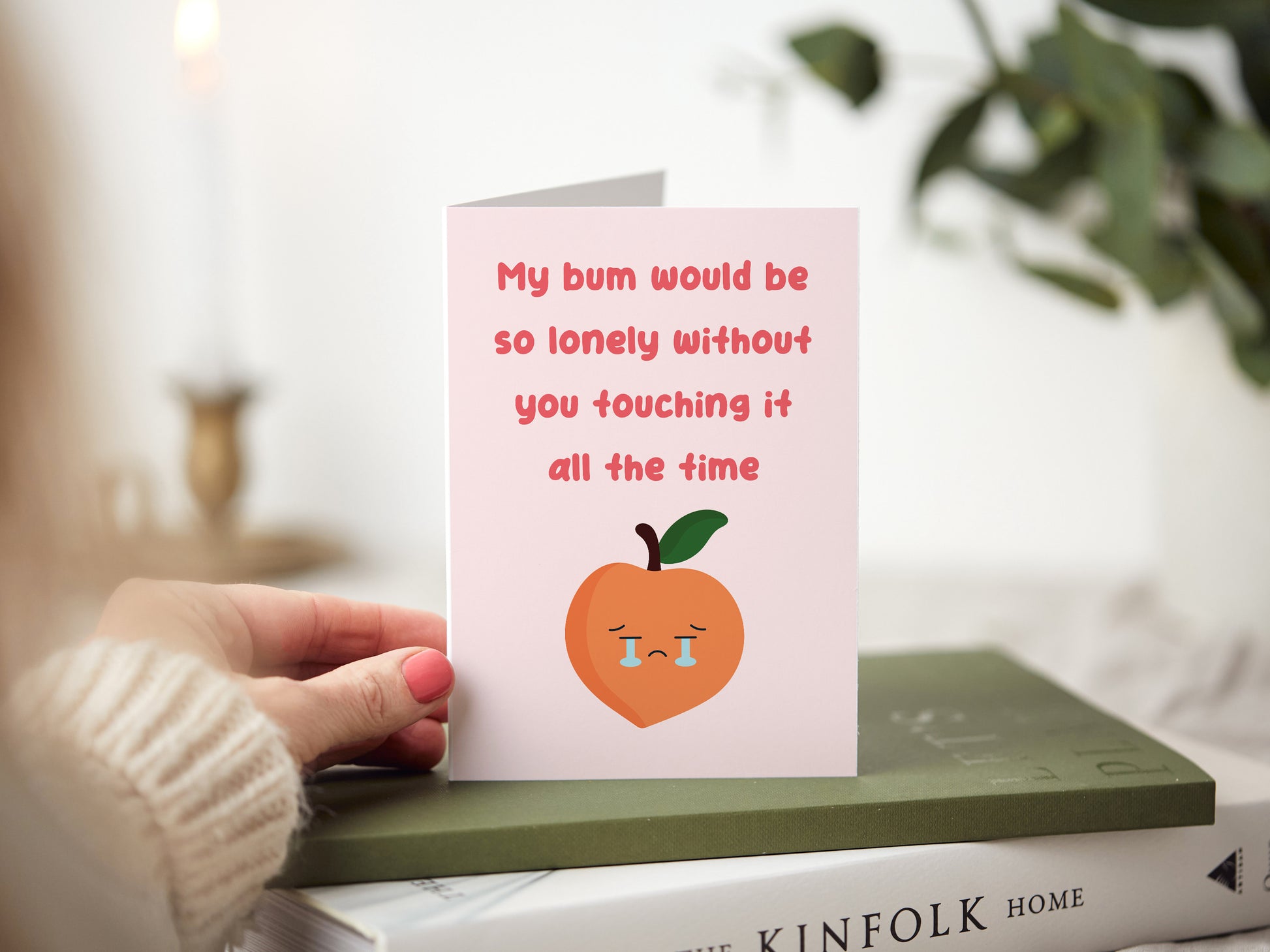 Anniversary card which reads 'my bum would be so lonely without you touching it all the time' and has a cartoon peach crying.