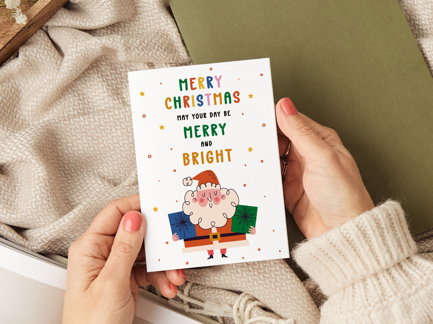 Christmas card which reads 'merry christmas may your day be merry and bright' with an illustration of Santa.