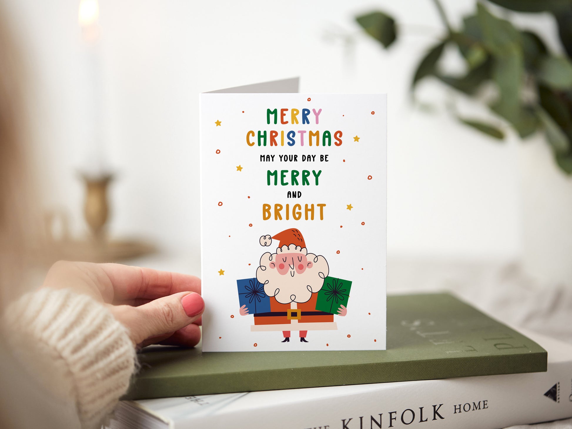 Christmas card which reads 'merry christmas may your day be merry and bright' with an illustration of Santa.