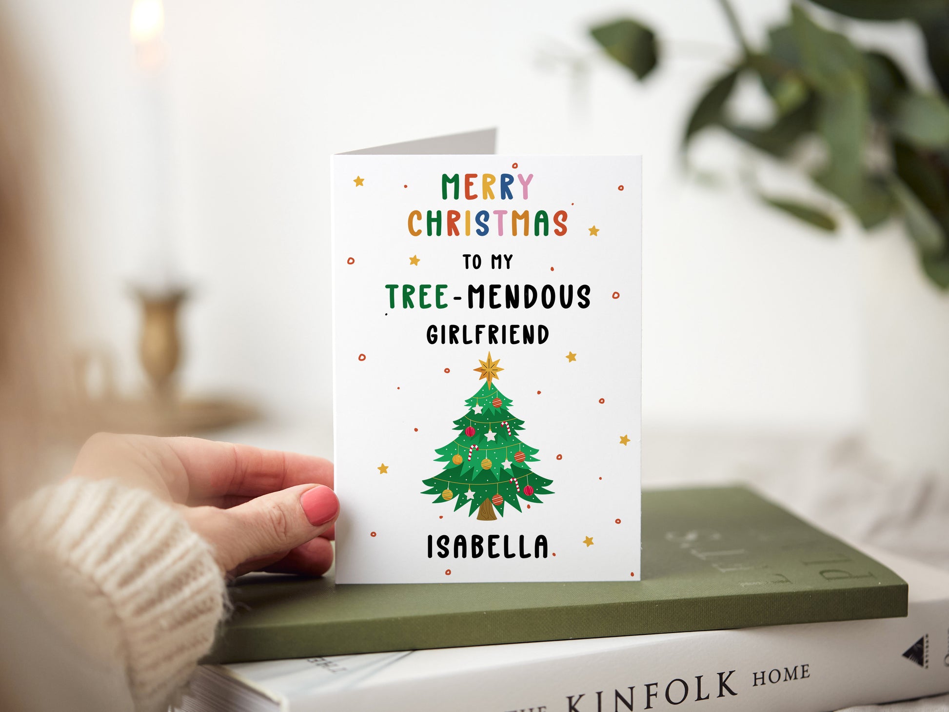 Christmas card which reads 'merry christmas to my tree-mendous girlfriend' with an illustration of a christmas tree.