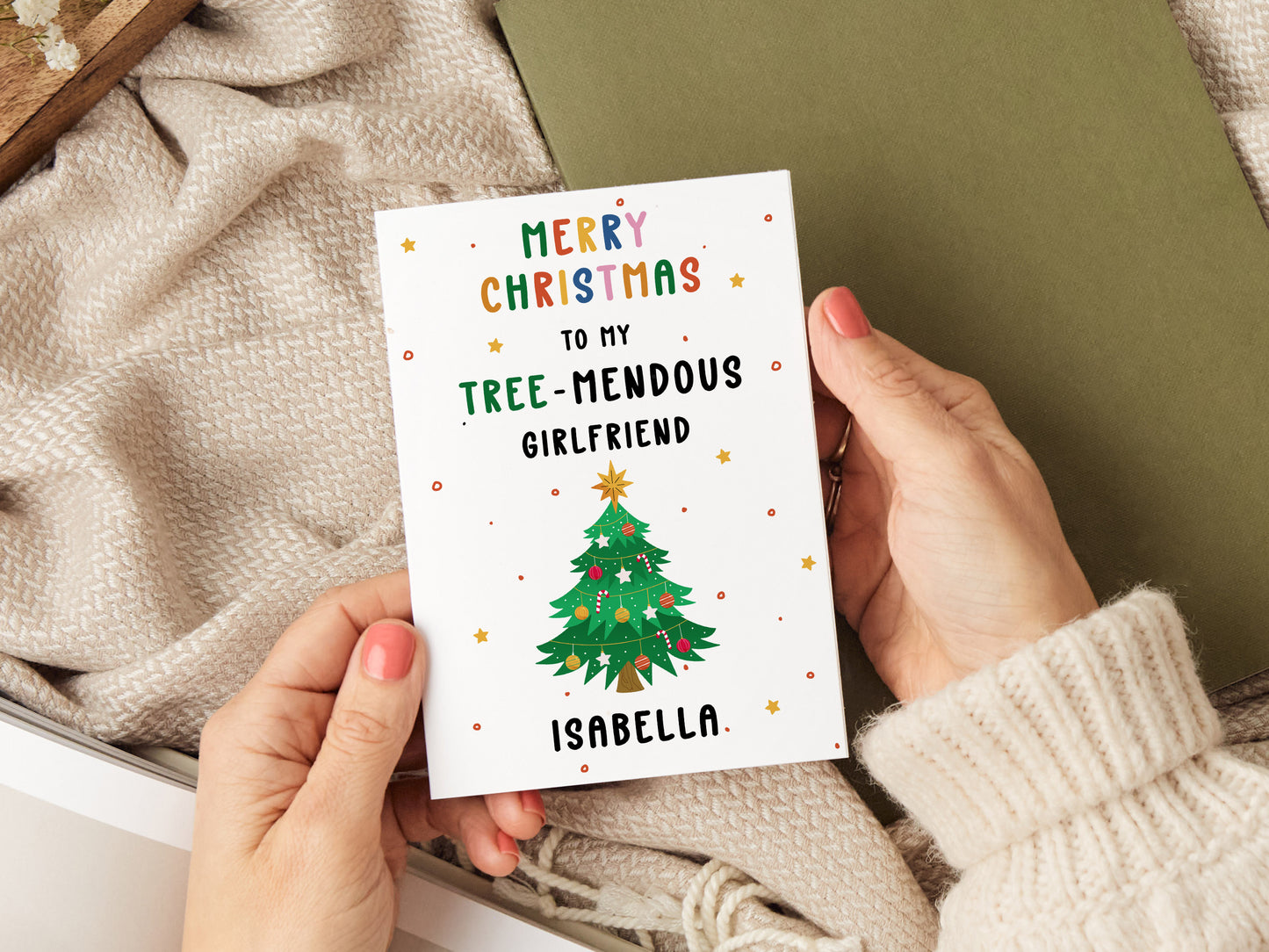 Christmas card which reads 'merry christmas to my tree-mendous girlfriend' with an illustration of a christmas tree.