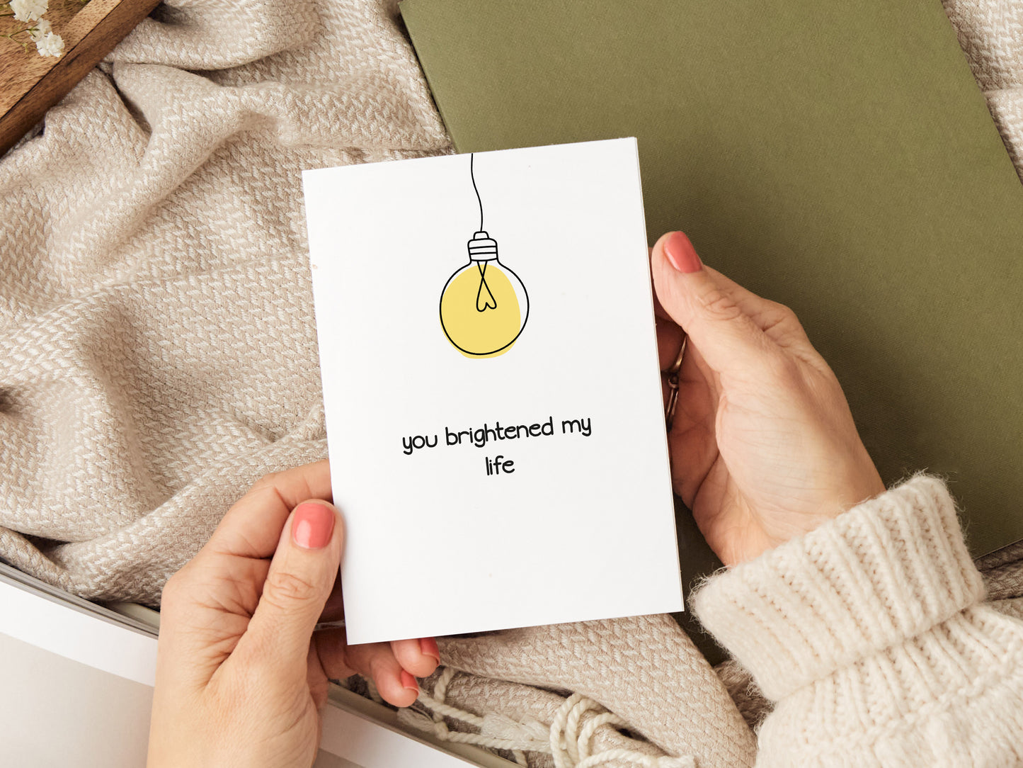 Anniversary card which reads 'you brightened my life' and has an illustration of a lightbulb.