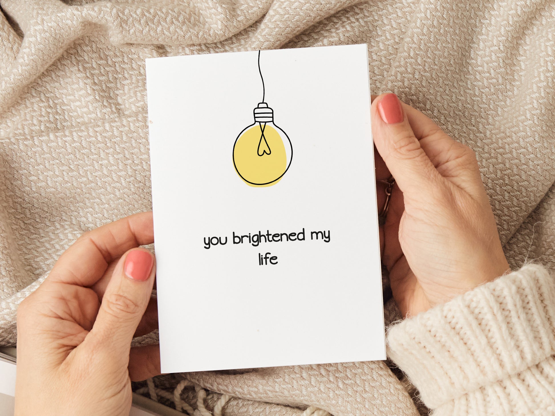 Anniversary card which reads 'you brightened my life' and has an illustration of a lightbulb.